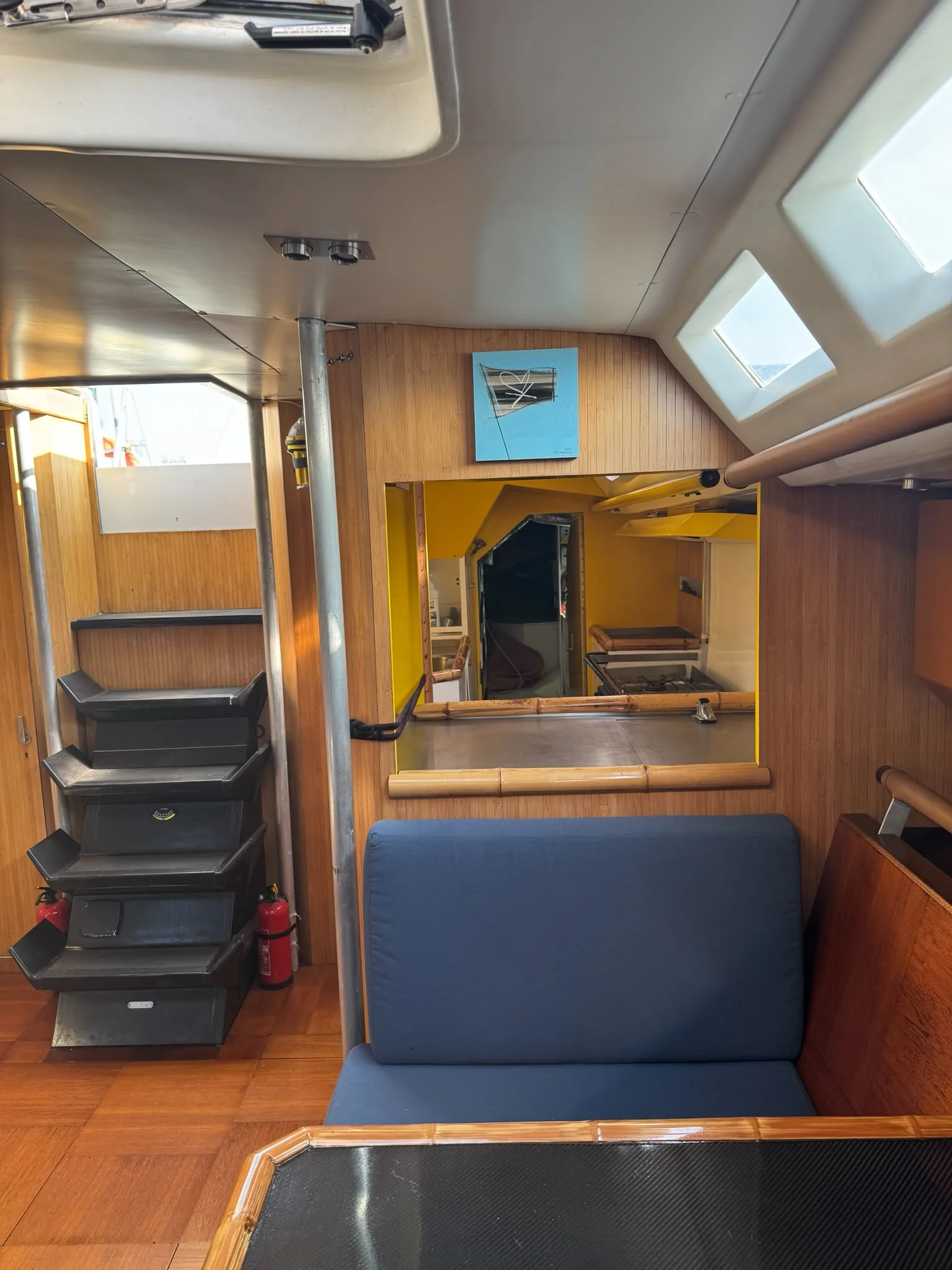 ZORYA Levrier 18 saloon with companionway steps and pass-through to the galley