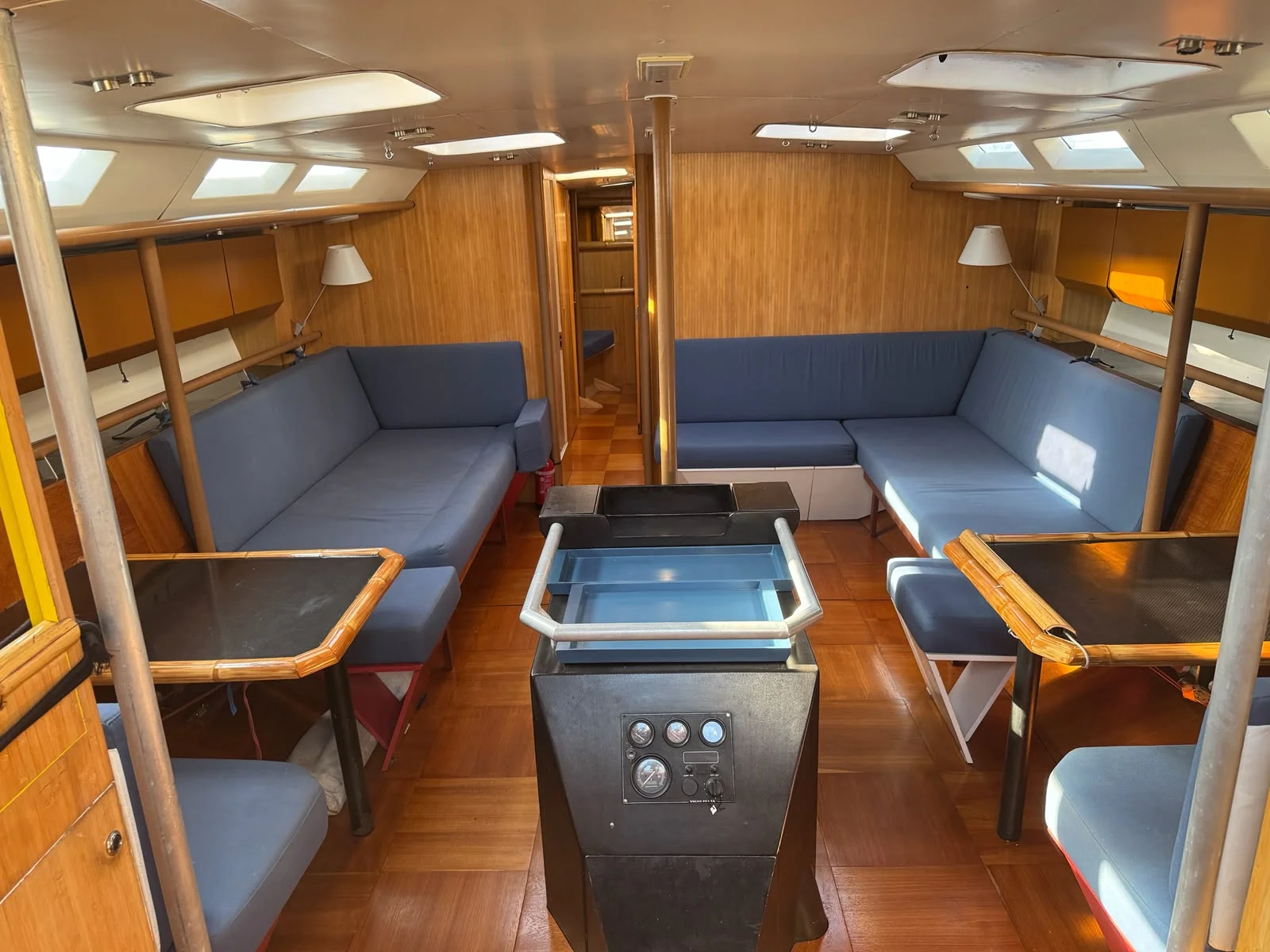 ZORYA Levrier 18 main saloon with facing settees, teak sole and overhead lighting