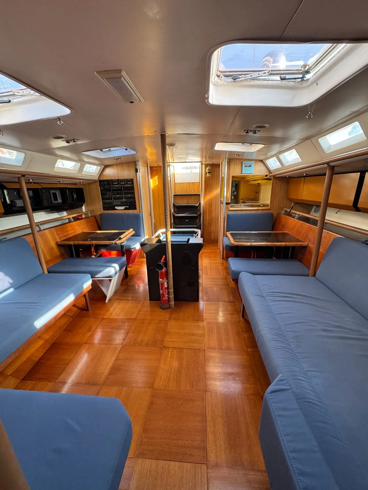 ZORYA Levrier 18 main saloon interior with twin settees, teak sole and overhead hatches